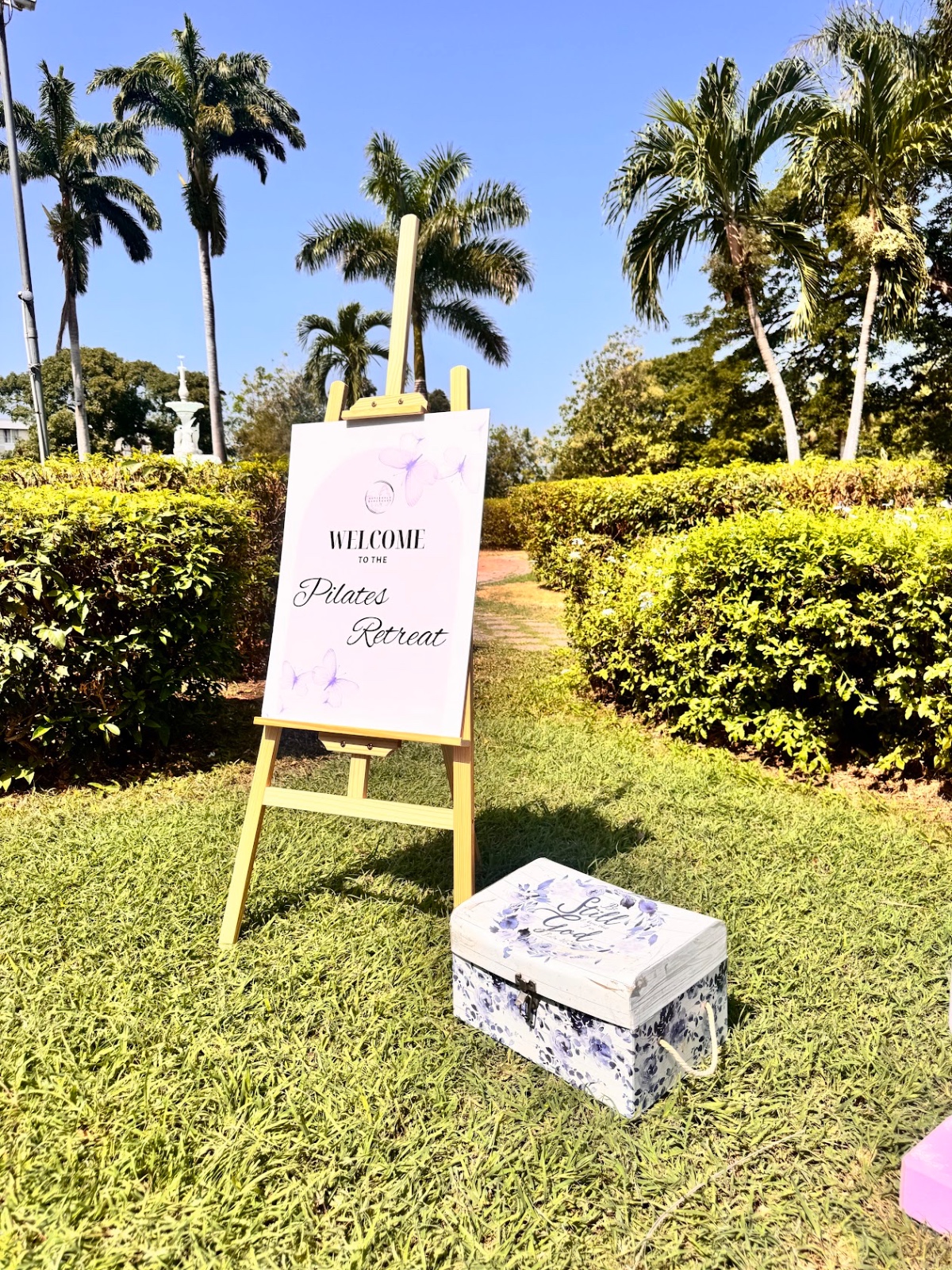 Welcome sign in tropical garden setting